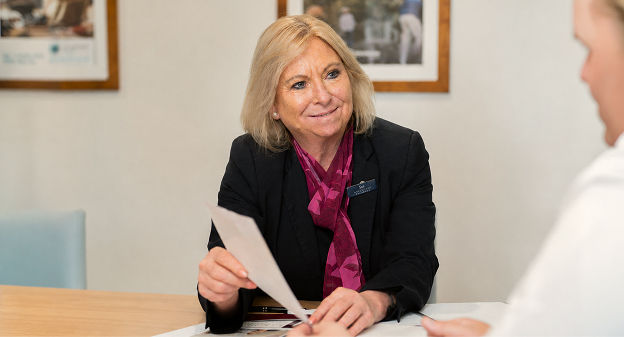 funeral director helping man